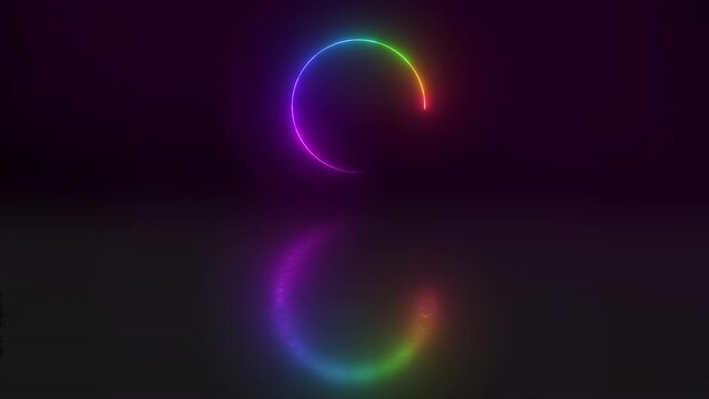 Illuminated rainbow neon lights in a circle shape or pattern against a dark background in studio. CGI circular art isolated on a black background. Special effects reflected in a mirror image
