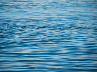 Blue sea water background texture. Sea background. Selective focus on center of image. Blue Water Background