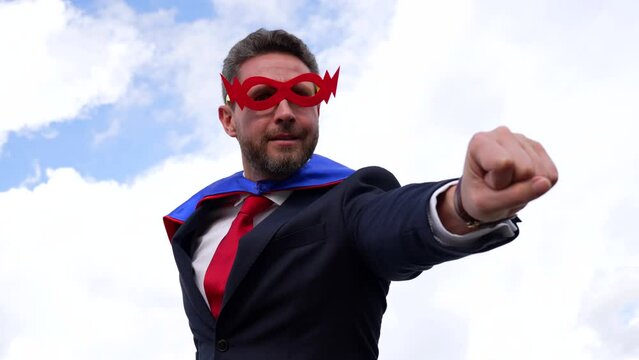 business success concept with man in super hero mask, slow motion, achievement