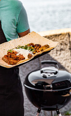 man chef grilling some meat outdoor
