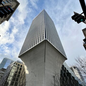 SEATTLE, WA, DEC 2021: looking up at Rainier Tower, a 41-storey skyscraper with a distinctive tapered base, designed by architect Minoru Yamasaki and located in Downtown