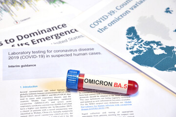 Blood tube for test detection of Virus Covid-19 Omicron BA.5 Variant on papers document. Concept for the New Variant from Virus SARS-CoV-2 "Omicron BA.5"