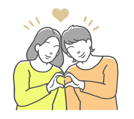 手でハートマークを作る同性カップル　女性