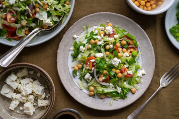 Healthy cabbage salad with tomatoes, parsley, onions, salad cheese, chickpeas. Detox, healthy food