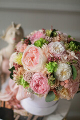 Beautiful summer flowers box of tender peonies, roses and hydrangea flowers. Preserved flowers for womens. Woman's day.