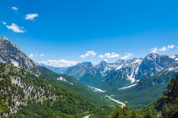 Fototapeta na wymiar Albanian Alps view. Accursed Mountains landscape viewed from Valbona and Theth hiking trail in Albania, popular hiking trail in the Albanian Alps.