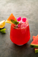 Watermelon drink, juice, lemonade with lemon and fresh mint leaves. Refreshing summer drink. Detox healthy beverage, watermelon smoothie. Copy space