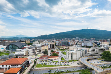 Fototapeta na wymiar Skopje cityscape, the capital of North Macedonia, Europe. Skopje aerial view of the city square and downtown from the fortress.