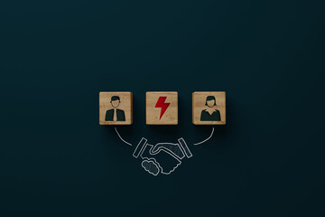 Wooden blocks with an icon of a man, woman, lightning bolt and shaking hands with consent. Divorce, mediation concept. Troubleshooting by a mediator.