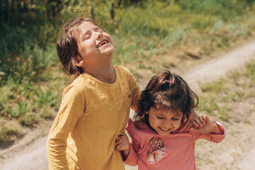 Happy sisters friends on holiday, playing children's game, having fun, enjoying the weekend in the village