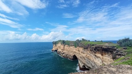 Fototapeta na wymiar a rock in the sea south of the island of Java, Indonesia