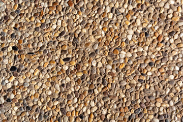 Gravel pavement texture bg, outdoor stone floor tile, brown, yellow and gray rocks
