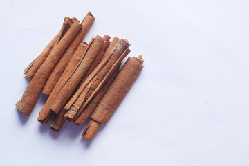 Cinnamon sticks on white background with copy space 