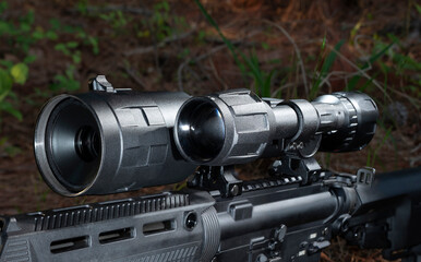 Night vision rifle scope on an assault rifle