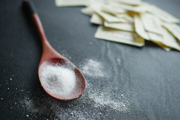 Sugar Substitute sweetener on a black background .