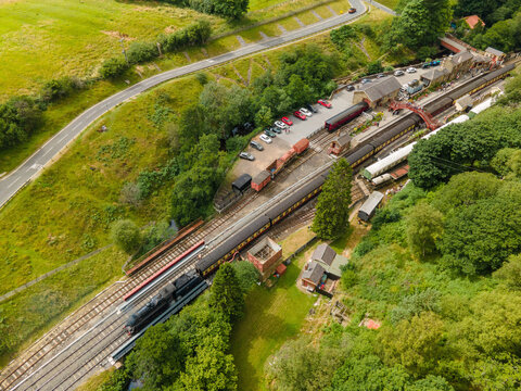 A drone view of a steam train leaving Goathland Station,
North York Moors