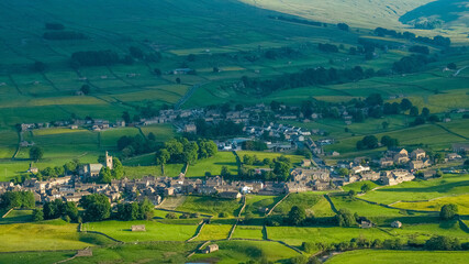 An Aerial view of Hawes a market town and civil parish in the Richmondshire district of North Yorkshire, England, at the head of Wensleydale in the Yorkshire Dales - obrazy, fototapety, plakaty