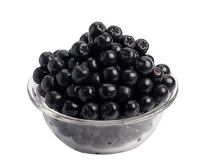 Chokeberry berries in a plate, isolated on a white background
