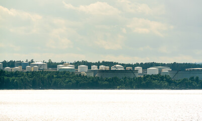 Big industrial oil tanks in a refinery facility.