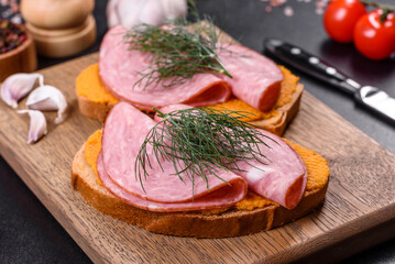 Delicious squash caviar sandwiches on a dark concrete background, healthy breakfast