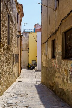 Badalona, Spain - June 18, 2020 . View of old street in Dalt la Vila, building with colored facade, historic center of Badalona, province of Barcelona, Spain.
