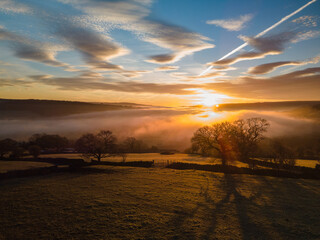 Sunrise over fields and countryside in the Aire Valley above Cononley near Skipton, North Yorkshire