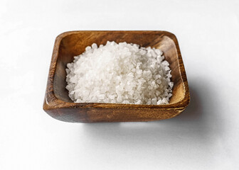 Fototapeta na wymiar Sea salt in a wooden salt shaker. Salt cellar