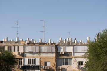 Typical architecture  with old buildings facade in israel. Sun Heat water boilers on roofs.