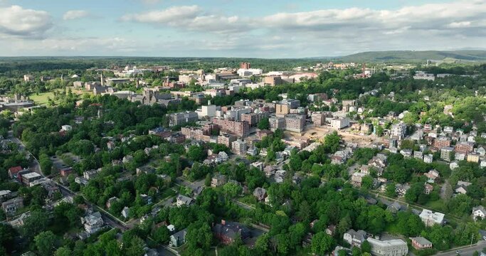 Late afternoon summer scenic aerial video of Ithaca NY, College Town.