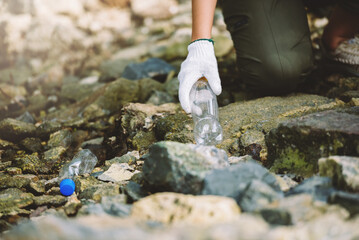 Close up group of diverse people volunteer teamwork ,environment conservation,volunteer help to picking plastic and foam garbage on park area.Volunteering world environment day.