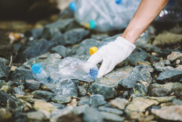 Close up group of diverse people volunteer teamwork ,environment conservation,volunteer help to picking plastic and foam garbage on park area.Volunteering world environment day.