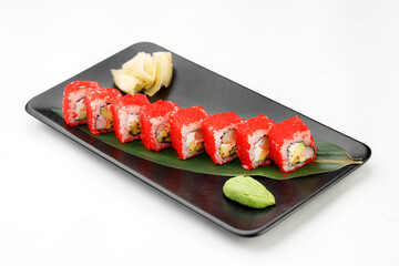 Sushi rolls with tobiko on a white background