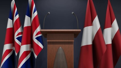 Flags of United Kingdom and Latvia at international meeting or negotiations press conference. Podium speaker tribune with flags and coat arms. 3d rendering