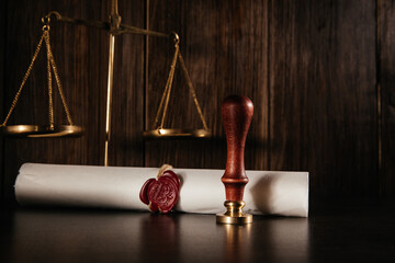 Gorisonatl image of old notarial wax seal and document on courtroom. Law concept