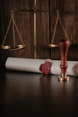 Notarial wax seal and document on courtroom. Law concept. Vertical image