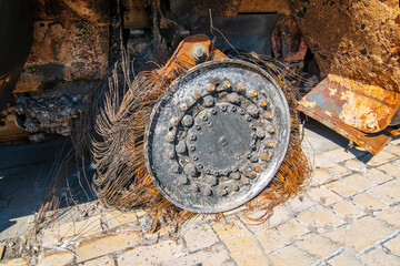 Burnt wheel of destroyed russian military armored car during Russian invasion of Ukraine in 2022