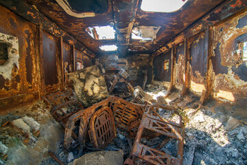 Fototapeta na wymiar Inside the destroyed russian military armored car during Russian invasion of Ukraine in 2022