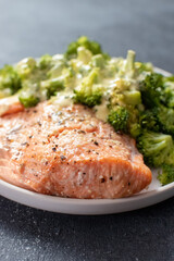 baked salmon fillet served with broccoli and butter sauce 