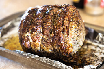 A large prime rib beef roast that was baked and roasted in the oven by a home gourmet chef for a holiday Christmas dinner