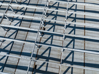 Aerial Photo Busy Industrial Construction Site. Factory Building. Construction Site with Cranes and Heavy Equipment.