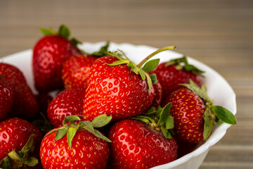 ripe, sweet strawberries in a white plate