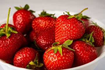 ripe, sweet strawberries in a white plate