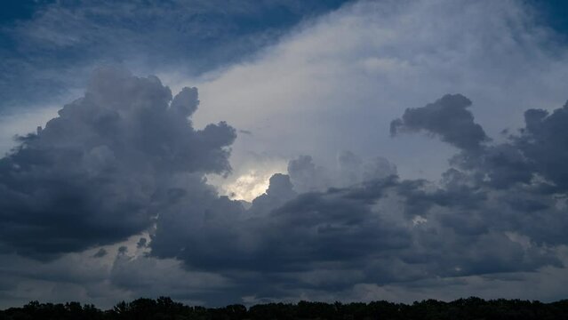 Timelaplse of dark storm clouds motion on evening sky