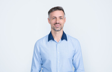 smiling mature entrepreneur in businesslike wear on grey background