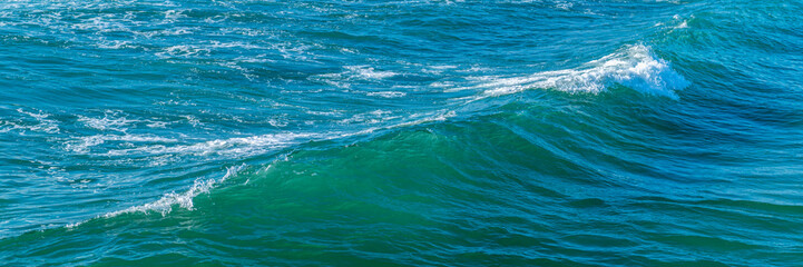 Beautiful beach Praia Da Barra and Costa Nova, famous getaways by Aveiro, Portugal. Atlantic Ocean with beautiful blue waters and clear sky