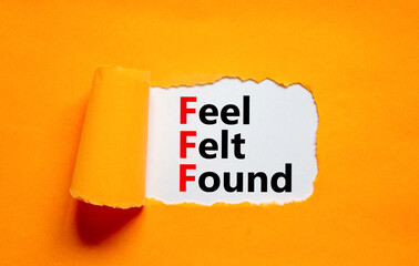 FFF feel felt found technique symbol. Concept words FFF feel felt found on white paper on a...