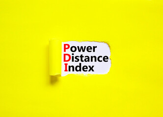 PDI power distance index symbol. Concept words PDI power distance index on white paper on a beautiful yellow background. Business PDI power distance index concept. Copy space.