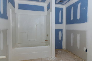 Construction of a bathroom with a bathtub for the new home of interior