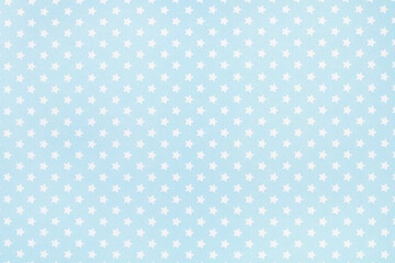 Textura fondo con estrellas blancas sobre un fondo celeste pastel. Vista de cerca.