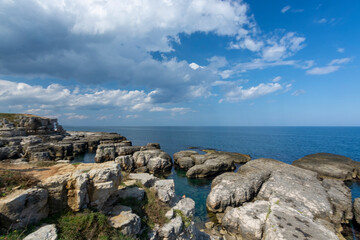 rock formations with blue cloudy sky